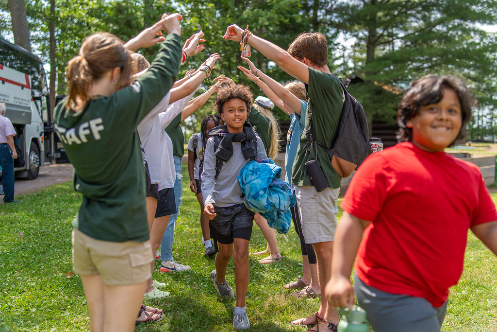 SCOPE campers welcomed by staff with a cheering arch tunnel
